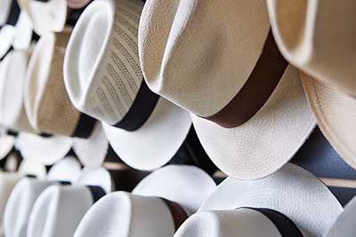 Artisan Panama hats on display at Montecristi in Yountville, featuring handcrafted South American design and fine materials.