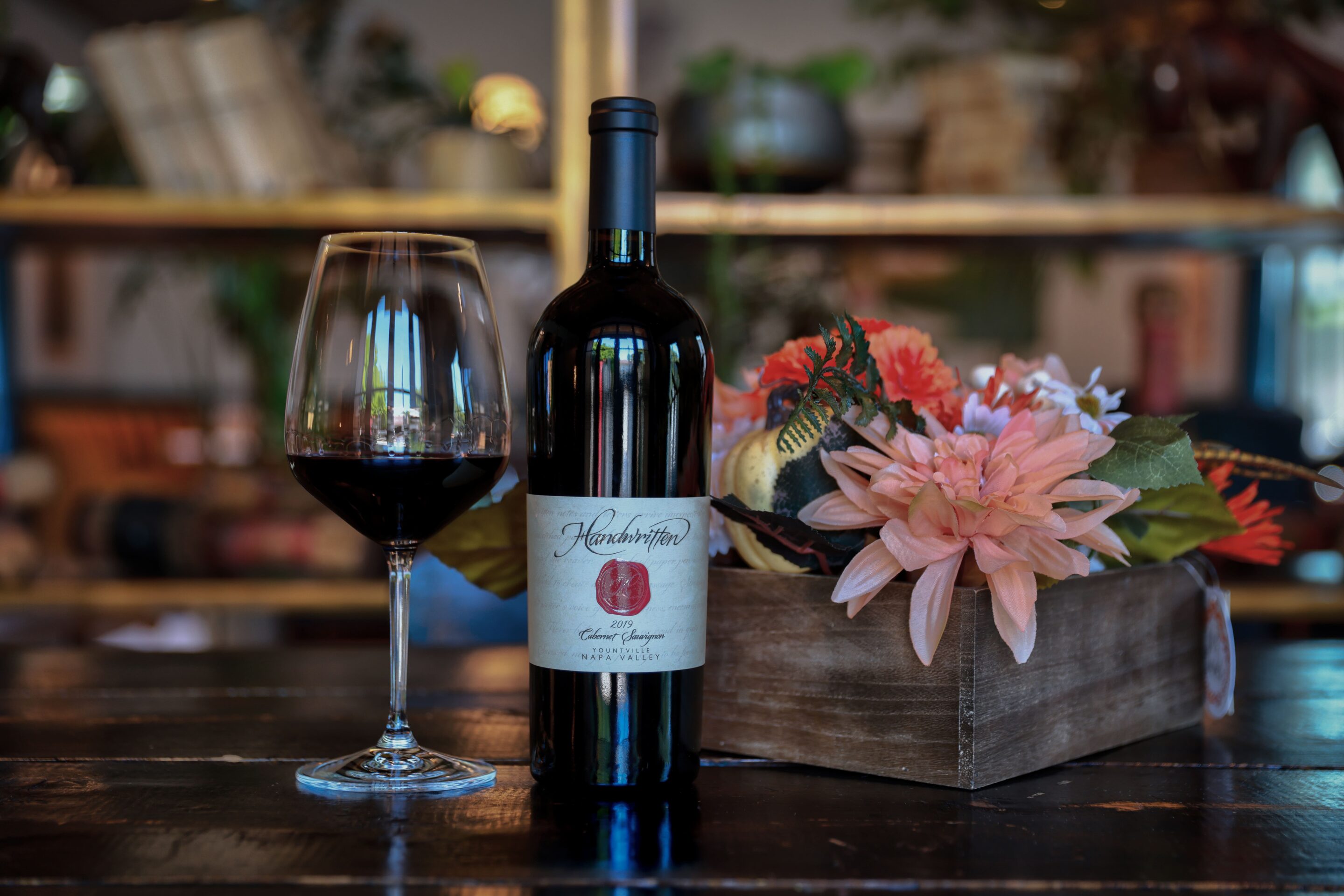 2019YountvilleCab (1) Cabernet Sauvignon in Yountville with flowers and a wine glass for same-day wine tasting Napa visitors