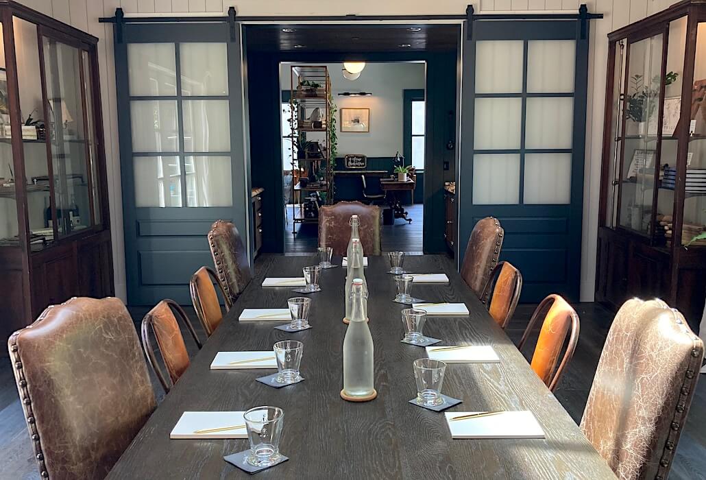 Spacious meeting room in Napa Valley with leather seating and natural lighting at Handwritten Wines in Yountville.
