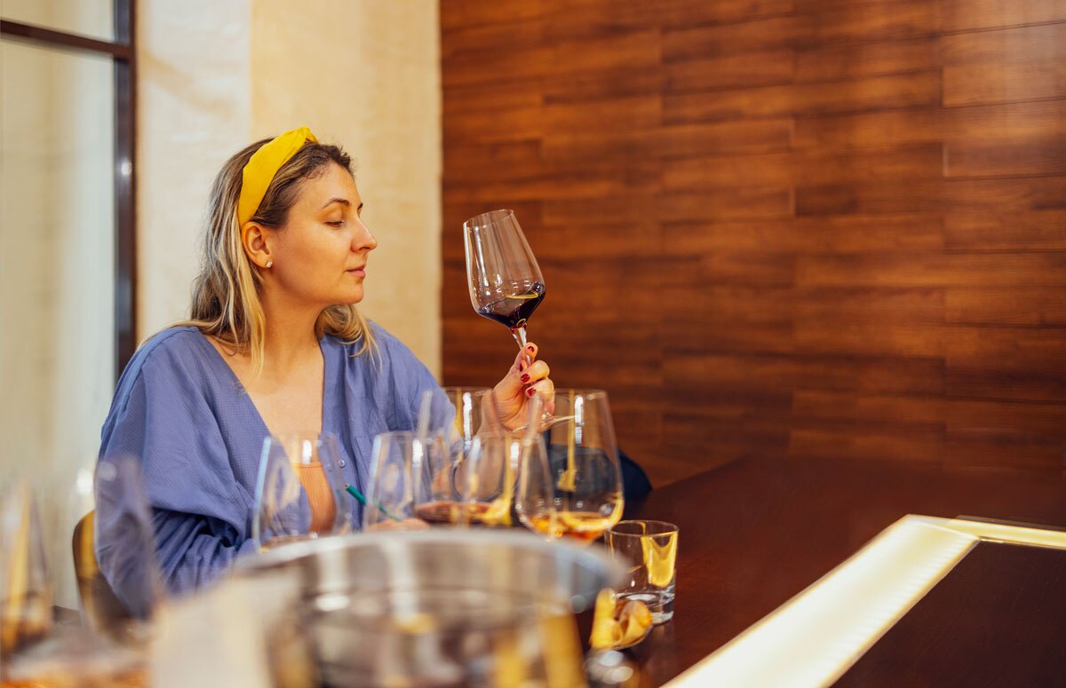 person wine tasting